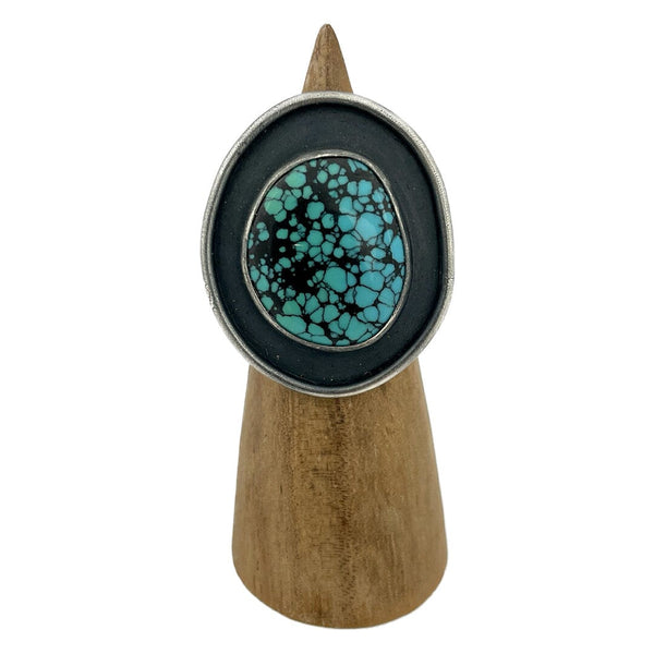This ring features a Hubei Turquoise cabochon set in a sterling silver shadow box setting