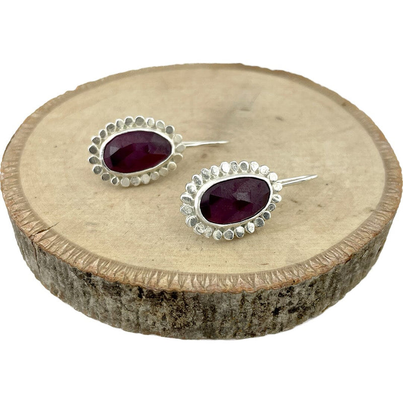 These beautiful earrings feature rose cut pink sapphires set in sterling silver.