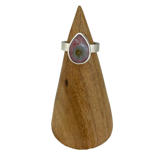 This ring features a teardrop shaped Ocean Jasper cabochon set in fine and sterling silver