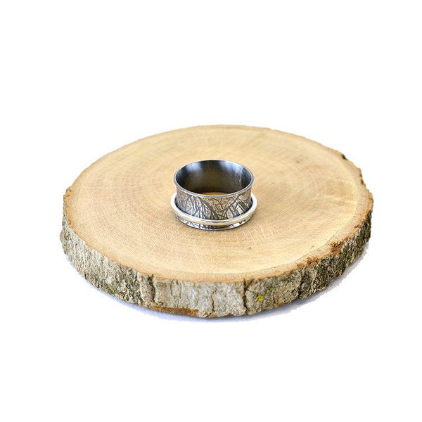 Oxidized sterling silver spinner ring with organic texture